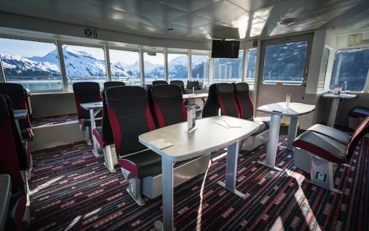 Passengers on the open deck of a tour boat in Kenai Fjords National Park