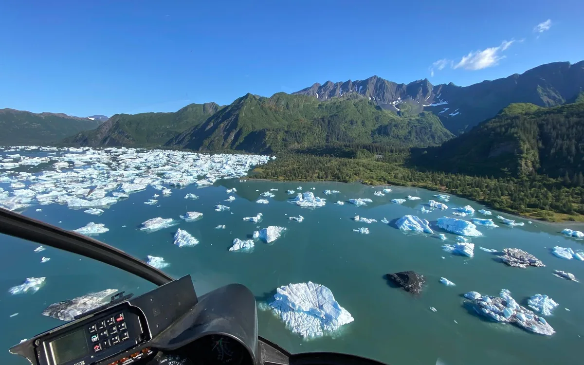 Icebergs floating on a glacial lagoon in Alaska seen from above