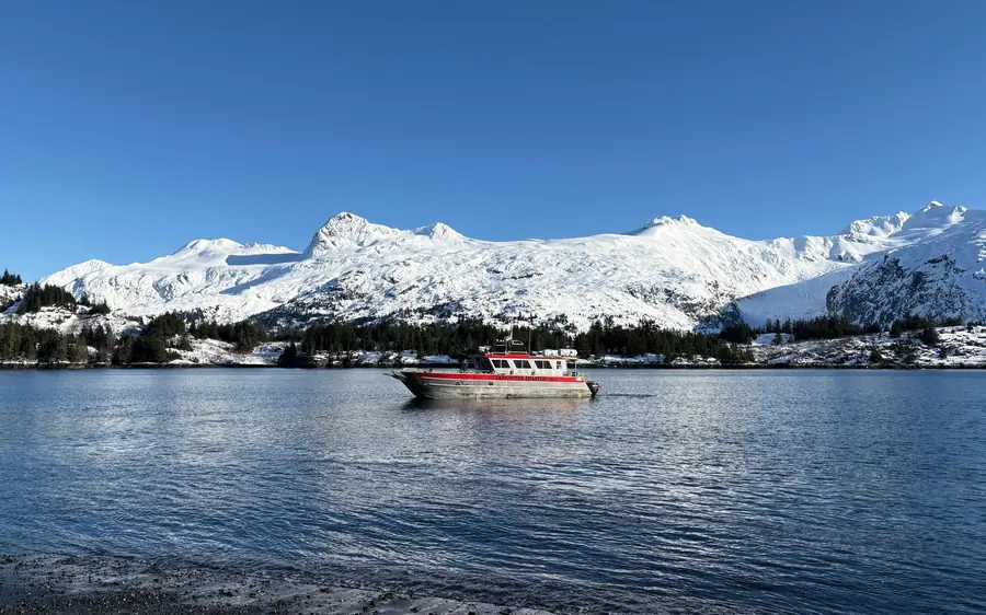A small boat in a sheltered bay near Blackstone Glacier, Prince William Sound